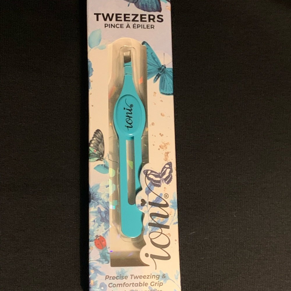Ioni tweezers Aqua/turquoise color. Brand new in box. Never opened.  *SOLD*